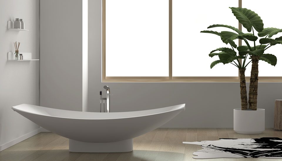 Mirage is Freestanding Hammock Bathtub supported by a skirting in a beautiful bathroom.