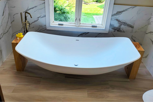 Oasis Hammock Bath with timber vanity and brass tapware in a modern New Jersey bathroom.